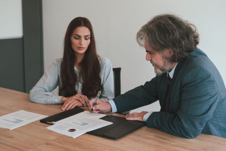 Business owners reviewing a letter of intent for a transaction.