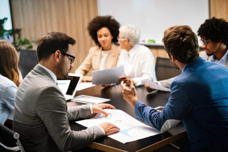 Business owner reviewing ownership and continuity documents with a successor